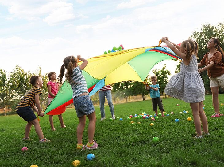 group of children playing games in a field