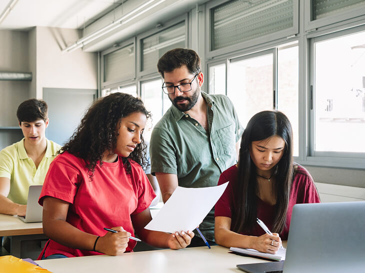 High school teacher helping student